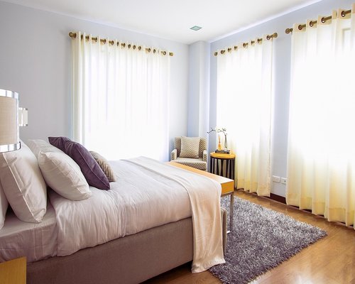 A peaceful bedroom setup with natural light